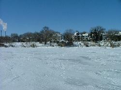 Lake Monona frozen over, the condition that draws ice fishermen through the Frost Woods Beach access courtesy of DrStarbuck from Madison, WI, USA&nearr; (CC BY 2.0&nearr;)