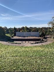 The amphitheater at Stephens Lake Park, home of the summer concert series. courtesy of CycoMa&nearr; (CC BY-SA 4.0&nearr;)