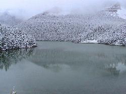 Crystal Lake after an early snowfall on the surrounding forest. courtesy of Forest Service Northern Region from Missoula, MT, USA&nearr; (Public domain&nearr;)