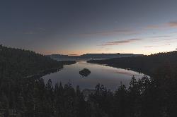 Emerald Bay at dusk from above the head of the bay, with Fannette Island in the middle of the water. courtesy of Levi Bare levibare1&nearr; (CC0&nearr;)
