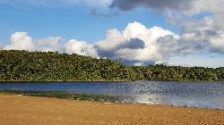 Eagle Lake and its wooded far shore seen from the Fort Custer swim beach. courtesy of Rmhermen&nearr; (CC BY-SA 4.0&nearr;)