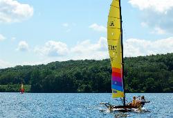 A catamaran sailing on Lake Arthur on a summer day. courtesy of Rona Proudfoot&nearr; (CC BY-SA 2.0&nearr;)