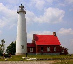 The white conical tower and red-roofed keeper's house at Tawas Point. courtesy of Asher196 (talk) 03:32, 18 July 2008 (UTC)&nearr; (CC BY-SA 3.0&nearr;)