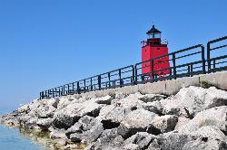 Clear Lake Michigan water against the armor stone at the base of the south pier. courtesy of abarndweller&nearr; (CC BY 2.0&nearr;)