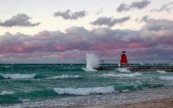 Storm waves breaking along the beach and over the south pier, the conditions to stay out of the wate courtesy of Scottb211 from Gaylord, Michigan, U.S.A.&nearr; (CC BY 2.0&nearr;)