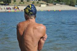 A swimmer looks back toward the buoy line and sand beach of the Castaic Lagoon swim area. courtesy of Chris Hunkeler from Carlsbad, California, USA&nearr; (CC BY-SA 2.0&nearr;)