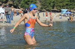 A young swimmer wades in from the swim beach during the 2016 open water festival. courtesy of Chris Hunkeler from Carlsbad, California, USA&nearr; (CC BY-SA 2.0&nearr;)