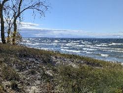Lake Ontario seen from the dune grass above the beach. courtesy of PunkToad&nearr; (CC BY 2.0&nearr;)