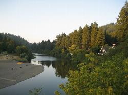 Looking upstream from the Monte Rio Bridge over the Russian River, with Monte Rio Beach along the le courtesy of eekim&nearr; (CC BY 2.0&nearr;)