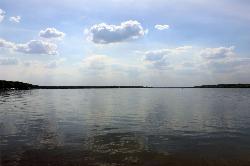 Calm Geneva Lake seen from the park's shore toward the far wooded shoreline. courtesy of Yinan Chen&nearr; (Public Domain&nearr;)