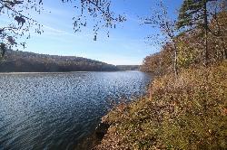 Calm water and a rocky shoreline on Council Bluff Lake in the Mark Twain National Forest. courtesy of Paul Sableman&nearr; (CC BY 2.0&nearr;)