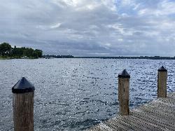 Looking across Wayzata Bay from a downtown Wayzata dock, the same bay the beach fronts. courtesy of Thomson200&nearr; (CC0&nearr;)