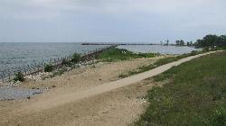 The paved trail and restored breakwater at the east end of the beach. courtesy of Chris Light&nearr; (CC BY-SA 4.0&nearr;)