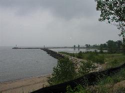The rock breakwater seen from the west end of the beach. courtesy of Chris Light&nearr; (CC BY-SA 4.0&nearr;)