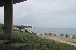 Looking out at the beach and Lake Michigan from beneath the pavilion. courtesy of Chris Light&nearr; (CC BY-SA 4.0&nearr;)
