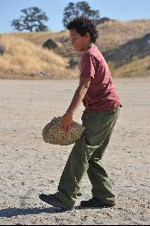A volunteer clearing rocks from the Hensley Lake swimming beach during National Public Lands Day. courtesy of U.S. Army Corps of Engineers Sacramento District&nearr; (Public domain&nearr;)