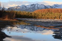 The Chugach Mountains reflected in Goose Lake during the May thaw. courtesy of Frank Kovalchek from Anchorage, Alaska, USA&nearr; (CC BY 2.0&nearr;)