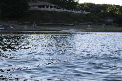 Seven Points Beach seen from the lake on a summer evening, with the swim-area buoy line in the foreg courtesy of Ron Shawley&nearr; (CC BY 3.0&nearr;)