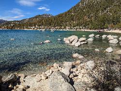 Granite boulders in the clear water of the cove beside Sand Point. courtesy of Blake Everett Carroll&nearr; (CC BY-SA 4.0&nearr;)