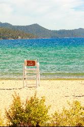 A lifeguard stand posted No Lifeguard on Duty on the beach at Sand Harbor. courtesy of Pink Sherbet Photography from USA&nearr; (CC BY 2.0&nearr;)