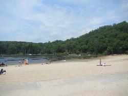Swimmers and sunbathers on Canopus Beach on a summer afternoon. courtesy of TheTurducken&nearr; (CC BY 2.0&nearr;)