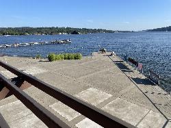 Waterfront plaza and pier looking out over Lake Washington, with the swim dock in the distance. courtesy of Steven Pavlov&nearr; (CC BY-SA 4.0&nearr;)