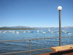 Boats on moorings in the water off Commons Beach, seen from the deck above the shore. courtesy of Keiichi Yasu&nearr; (CC BY-SA 2.0&nearr;)