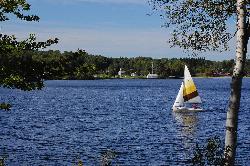 A small sailboat on Lake Elmore, the lake the state park beach fronts. courtesy of BrKing&nearr; (CC BY 2.0&nearr;)