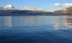 Calm Lake Tahoe water off Pope Beach looking toward the mountains of the south and east shore. courtesy of Ken Lund&nearr; (CC BY-SA 2.0&nearr;)