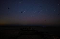 Night sky over Lake Erie from the sand at Huntington Beach, with a rock breakwall leading into the w courtesy of Erik Drost &nearr; (CC BY 2.0&nearr;)