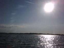 Afternoon sun over Gun Lake from Yankee Springs Recreation Area. courtesy of hywell&nearr; (CC BY 2.0&nearr;)