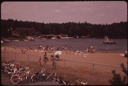 Swimmers at the Old Forge public beach in August 1973, photographed by Anne LaBastille for the EPA.