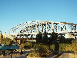 Picnic ramadas and trees in Gateway Park with the Ocean-to-Ocean Bridge spanning the river behind th courtesy of Marine 69-71&nearr; (CC BY-SA 4.0&nearr;)