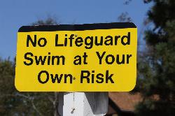 Corps of Engineers sign at Big Hill Lake warning that no lifeguard is on duty. courtesy of usacetulsa&nearr; (CC BY 2.0&nearr;)