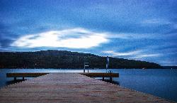 The T-shaped dock with swim ladders at Champlin Beach at dusk. courtesy of See1,Do1,Teach1&nearr; (CC BY 2.0&nearr;)
