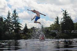 Swimmers jumping into Horseshoe Lake on a summer afternoon. courtesy of return the sun&nearr; (CC BY 2.0&nearr;)