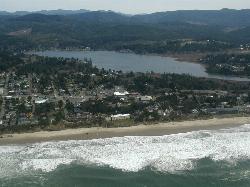 Aerial view of Devils Lake behind Lincoln City, seen from over the Pacific. courtesy of DLWID at English Wikipedia&nearr; (CC BY 2.5&nearr;)