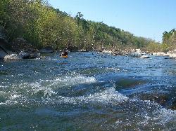 A kayaker running the St. Francis River at Silver Mines Recreation Area during higher water. courtesy of Kbh3rd&nearr; (CC BY-SA 3.0&nearr;)