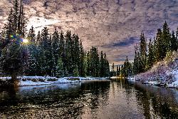 Early winter sunrise at the inlet where the North Fork Payette River enters Payette Lake beside Nort courtesy of Knowles Gallery&nearr; (CC BY 2.0&nearr;)